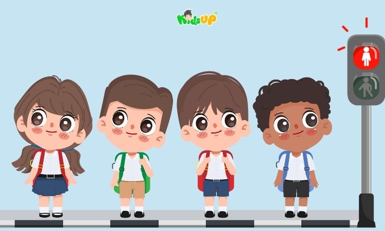 Qua đường theo nhóm thì một bạn sẽ để ý đèn tín hiệu giao thông cho các bạn đi sau